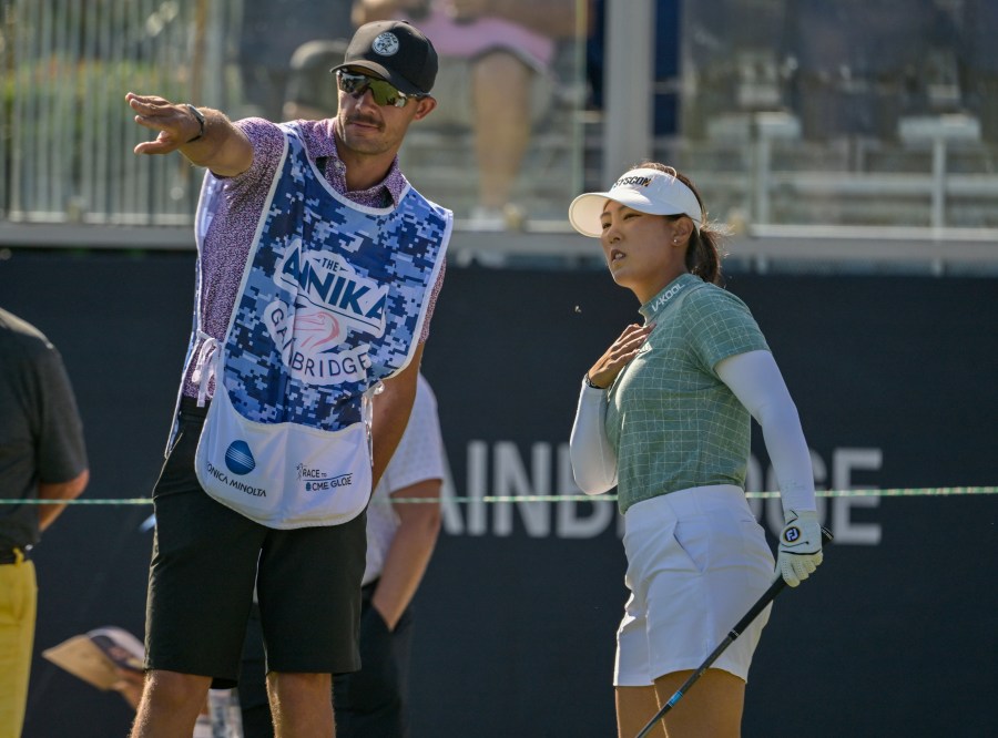 Jiwon Jeon, right, of South Korea, talks with her caddy on the first tee during the first round of The Annika golf tournament at Pelican Golf Club, Thursday, Nov. 14, 2024, in Belleair, Fla. (AP Photo/Steve Nesius)