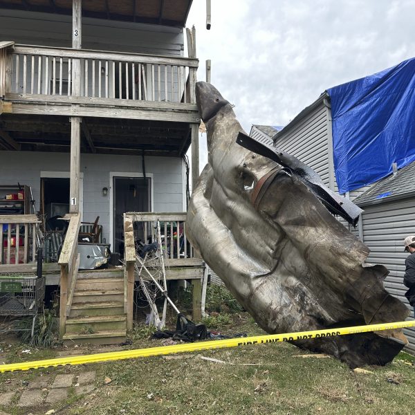 A massive piece of debris that flew from the Givaudan Color Sense plant after an explosion is pictured on Wednesday, Nov. 13, 2024 in Louisville, Ky. (AP Photo/Dylan Lovan)