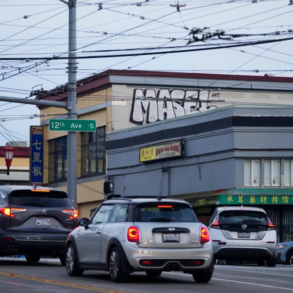 Drivers move through the area where multiple people were stabbed earlier Friday, Nov. 8, 2024, in the Chinatown-International District in Seattle. (AP Photo/Lindsey Wasson)