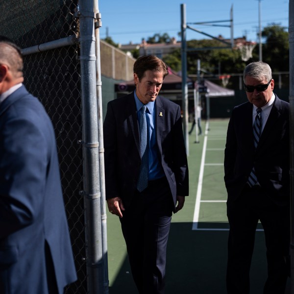 Nathan Hochman, the newly elected Los Angeles County district attorney, talks with Redondo Beach, Calif., city attorney Michael Webb, right, during a Housing Initiative Court session in Hermosa Beach, Calif., Wednesday, Nov. 13, 2024. (AP Photo/Jae C. Hong)