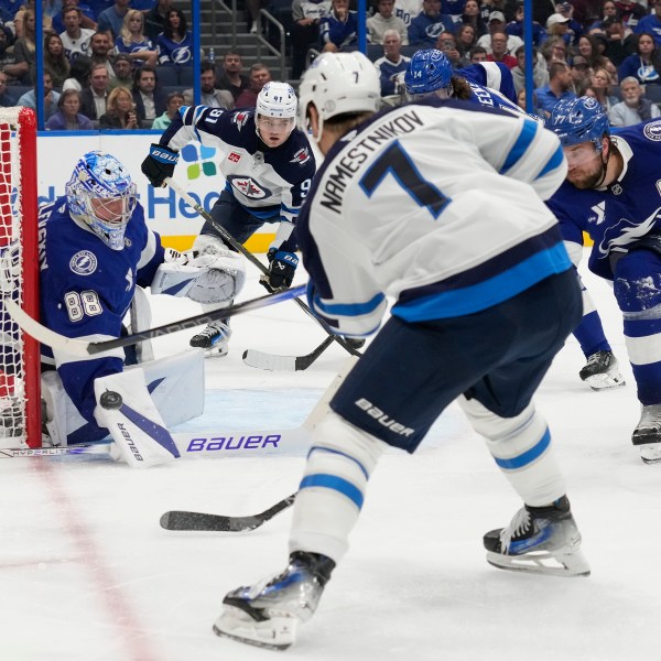 Tampa Bay Lightning goaltender Andrei Vasilevskiy (88) stops a shot by Winnipeg Jets center Vladislav Namestnikov (7) during the third period of an NHL hockey game Thursday, Nov. 14, 2024, in Tampa, Fla. (AP Photo/Chris O'Meara)