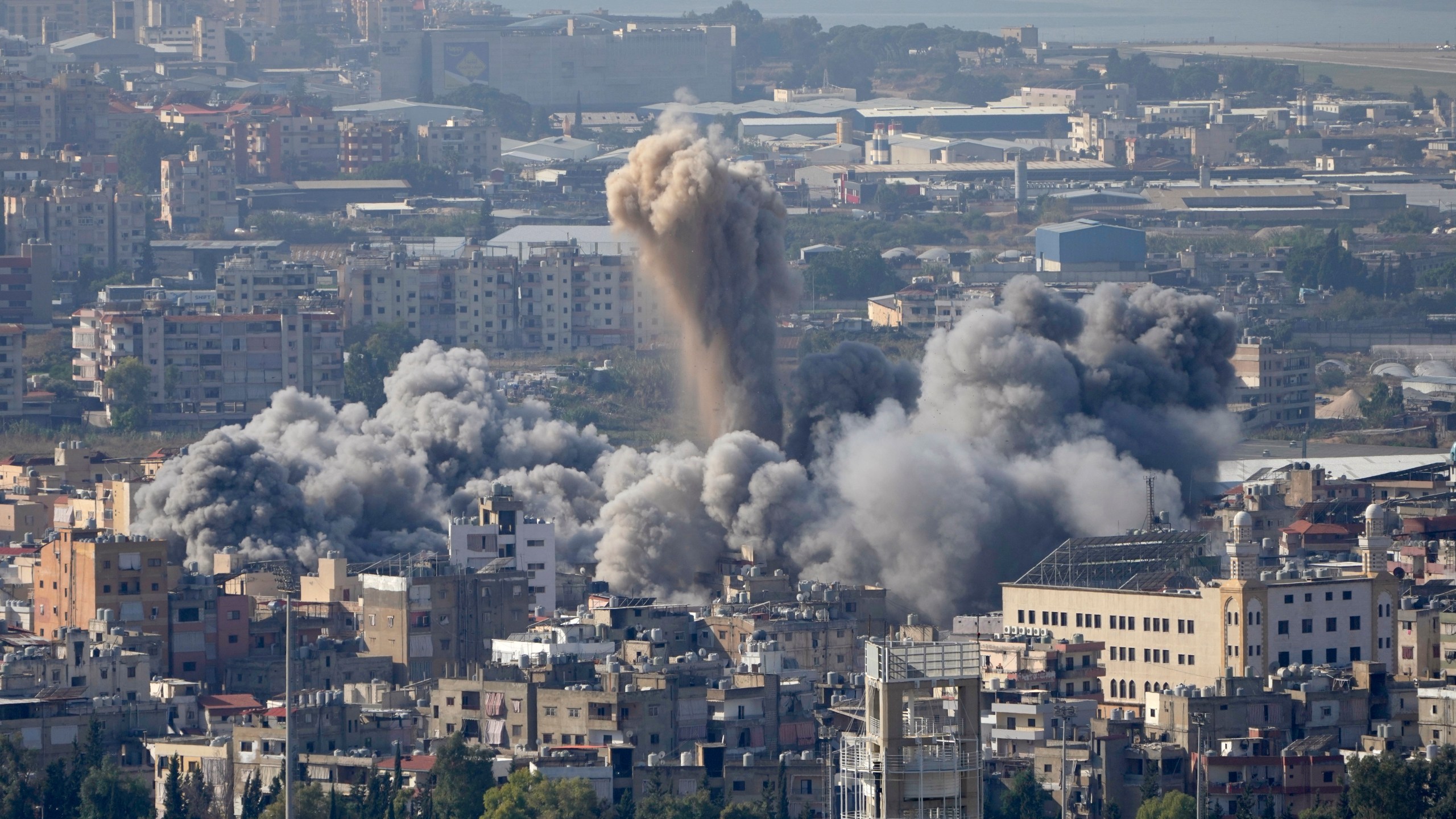 Smoke rises between buildings hit by an Israeli airstrike in Dahiyeh, the southern suburb of Beirut, Lebanon, Thursday, Nov. 14, 2024. (AP Photo/Hussein Malla)