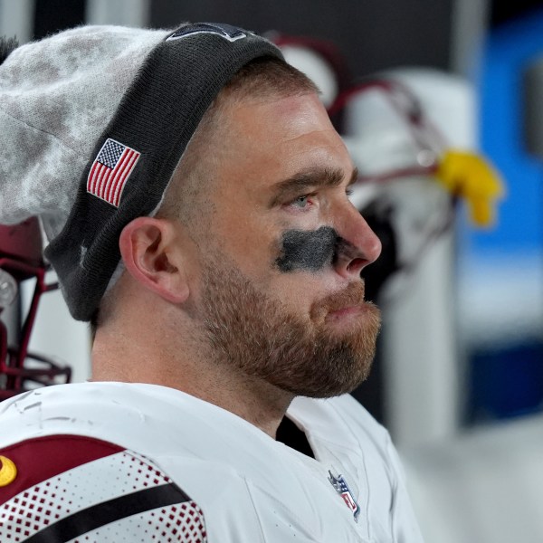 Washington Commanders tight end Zach Ertz sits on the bench during the second half of an NFL football game against the Philadelphia Eagles Thursday, Nov. 14, 2024, in Philadelphia. (AP Photo/Chris Szagola)