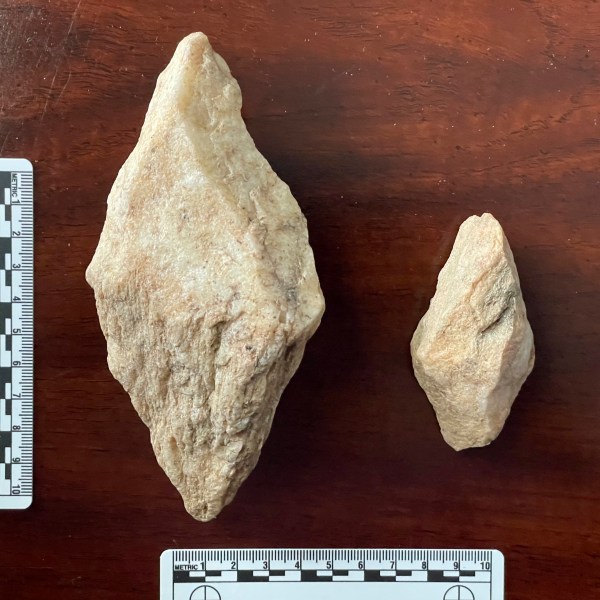 This undated photo provided by Philip LaPorta shows two bipointed quarry picks fashioned from quartz mylonite that were uncovered during an archaeological survey of the Seniard Creek Fire scar south of Asheville, North Carolina. (Philip LaPorta via AP)