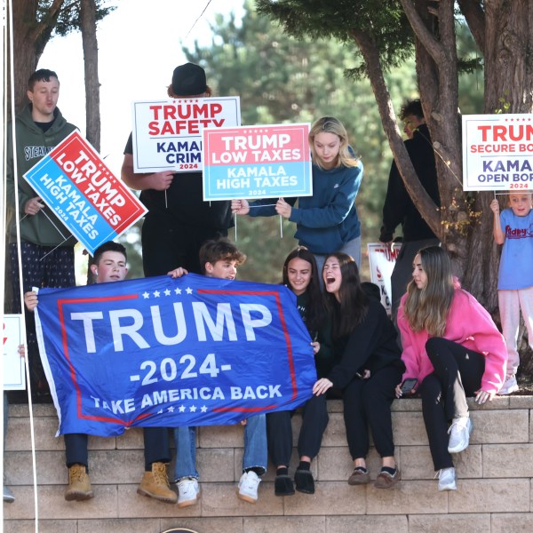 Young Trump supporters gather outside Ridley High School before Elon Musk leads a America PAC Town Hall in Delaware County, Pa., at Ridley High School on Thursday, Oct. 17, 2024. (Charles Fox/The Philadelphia Inquirer via AP)