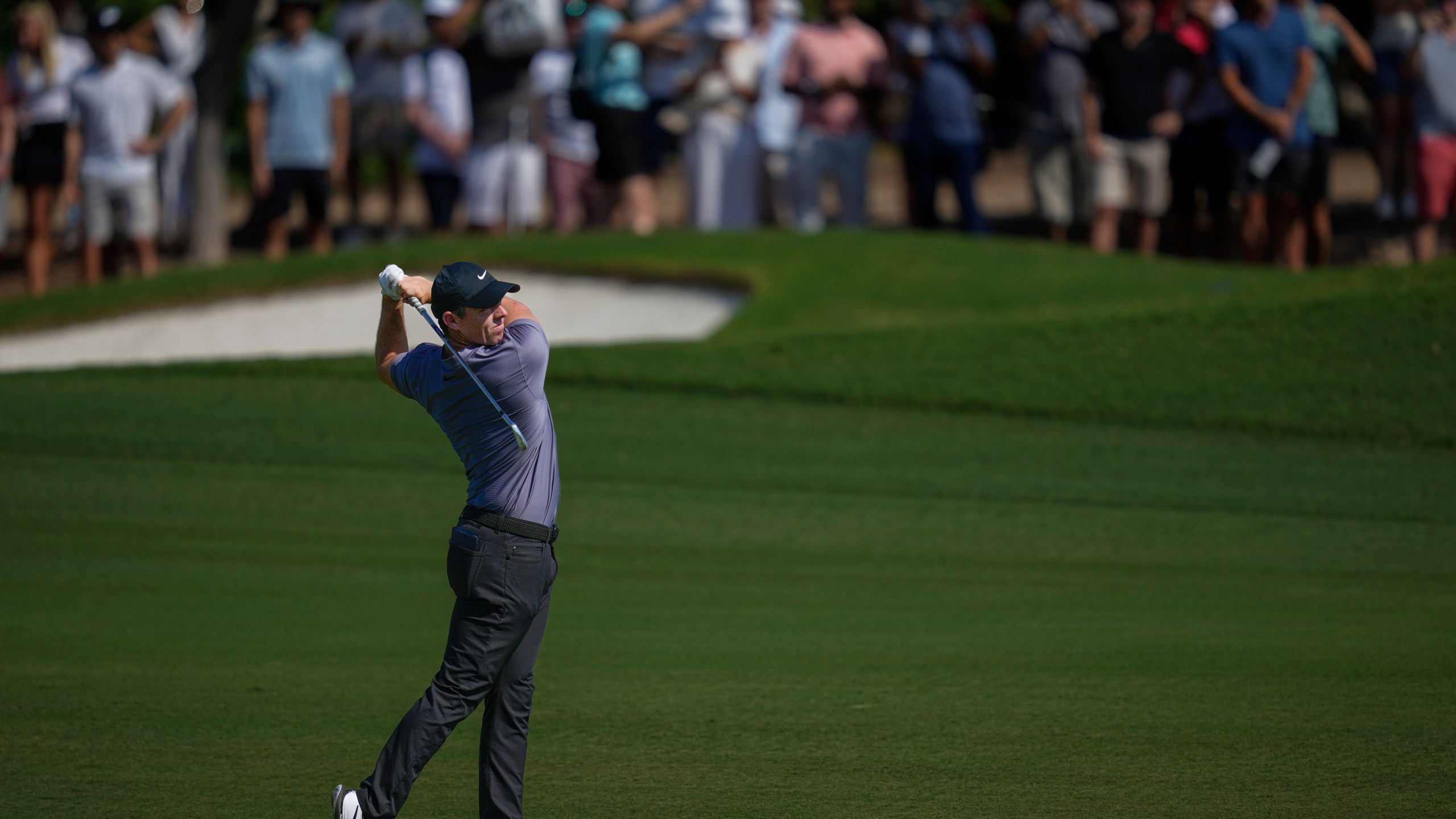 Rory McIlroy of Northern Ireland plays his second shot on the 3rd hole during the second round of World Tour Golf Championship in Dubai, United Arab Emirates, Friday, Nov. 15, 2024. (AP Photo/Altaf Qadri)