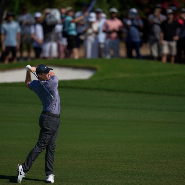 Rory McIlroy of Northern Ireland plays his second shot on the 3rd hole during the second round of World Tour Golf Championship in Dubai, United Arab Emirates, Friday, Nov. 15, 2024. (AP Photo/Altaf Qadri)