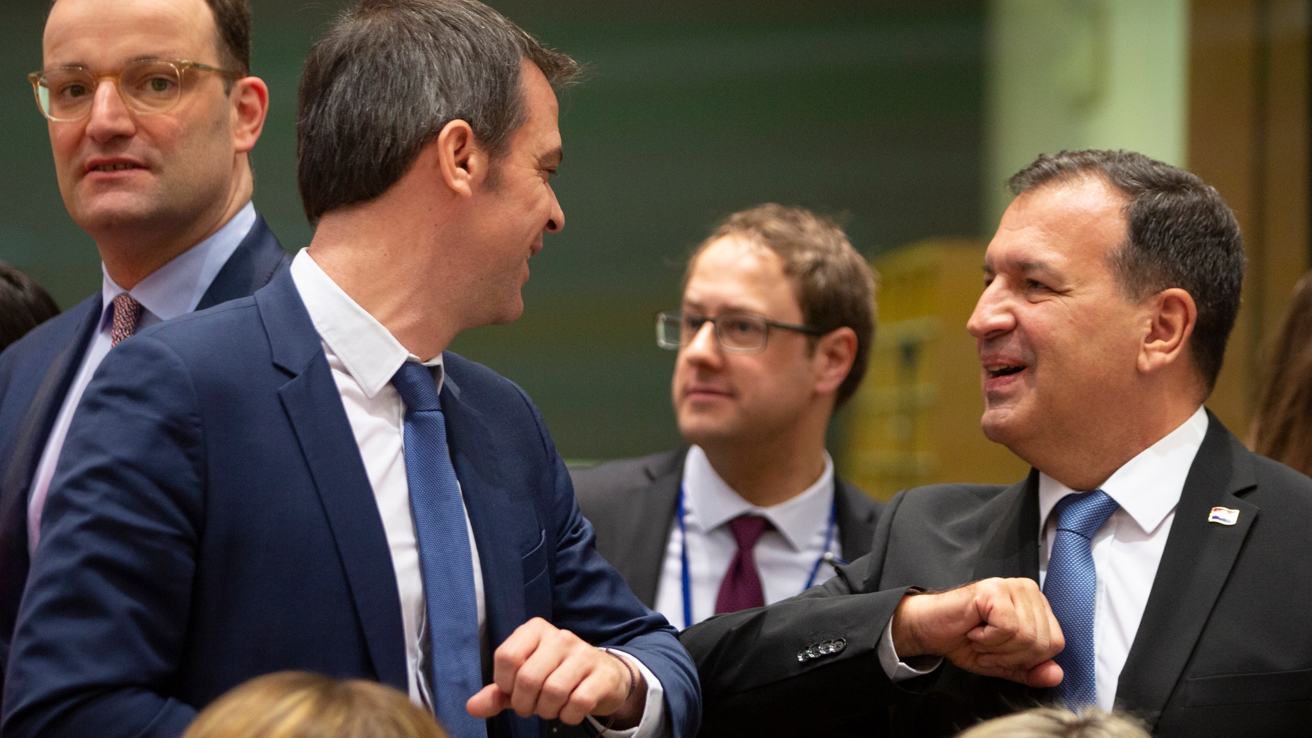 FILE -Croatian Health Minister Vili Beros, right, bumps elbows to say hello to French Health Minister Olivier Veran during an extraordinary meeting of EU health ministers in Brussels to discuss the virus outbreak, March 6, 2020. (AP Photo/Virginia Mayo, File)