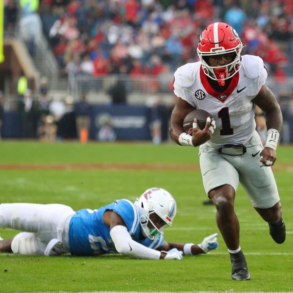 Georgia running back Trevor Etienne (1) runs the ball during the first half of an NCAA college football game against Mississippi on Saturday, Nov. 9, 2024, in Oxford, Miss. (AP Photo/Randy J. Williams)