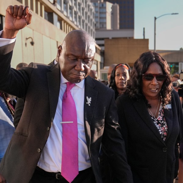 FILE - Attorney Ben Crump, left, RowVaughn Wells, right, leave the federal courthouse after three former Memphis police officers were convicted of witness tampering charges in the 2023 fatal beating of Tyre Nichols, Oct. 3, 2024, in Memphis, Tenn. (AP Photo/George Walker IV, File)