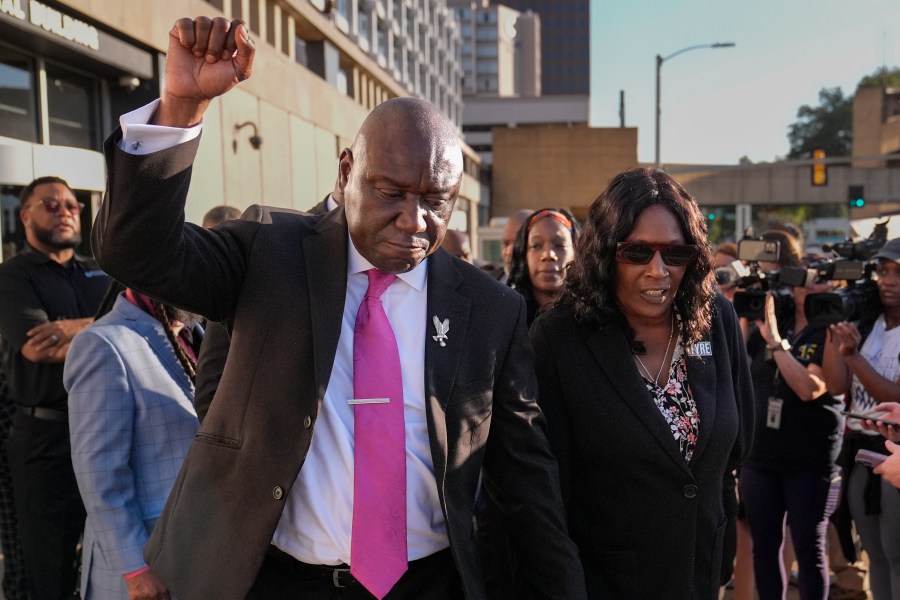 FILE - Attorney Ben Crump, left, RowVaughn Wells, right, leave the federal courthouse after three former Memphis police officers were convicted of witness tampering charges in the 2023 fatal beating of Tyre Nichols, Oct. 3, 2024, in Memphis, Tenn. (AP Photo/George Walker IV, File)