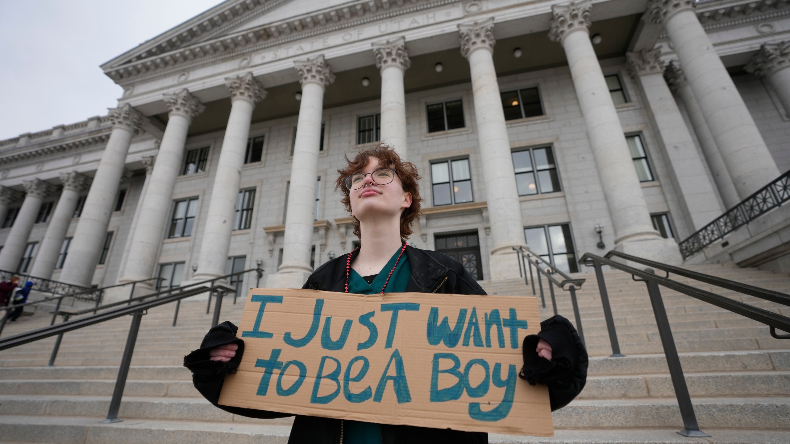 FILE - Tree Crane, 17, stands for a portrait following a rally where hundreds gathered in support of transgender youth at the Utah State Capitol Tuesday, Jan. 24, 2023, in Salt Lake City. (AP Photo/Rick Bowmer, File)