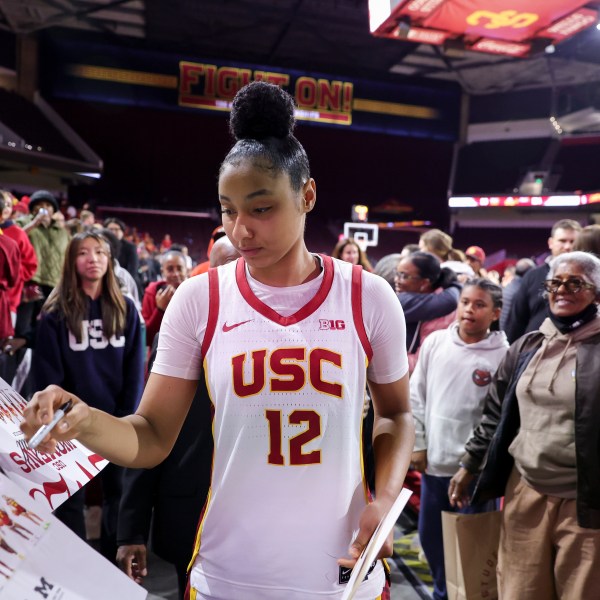 Southern California guard JuJu Watkins signs autographs after an NCAA women's basketball game against Cal State Northridge Tuesday, Nov. 12, 2024, in Los Angeles. (AP Photo/Ryan Sun)