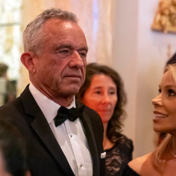 Robert F. Kennedy Jr., and his wife Cheryl Hines arrive before President-elect Donald Trump speaks during an America First Policy Institute gala at his Mar-a-Lago estate, Thursday, Nov. 14, 2024, in Palm Beach, Fla. (AP Photo/Alex Brandon)