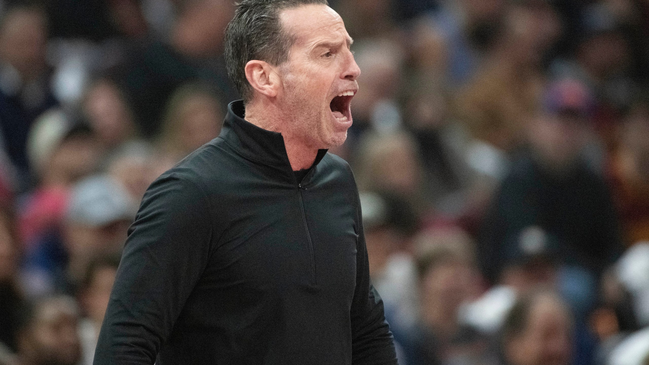 Cleveland Cavaliers head coach Kenny Atkinson yells instructions to his team during the first half of an Emirates NBA basketball game against the Chicago Bulls in Cleveland, Friday, Nov 15, 2024. (AP Photo/Phil Long)