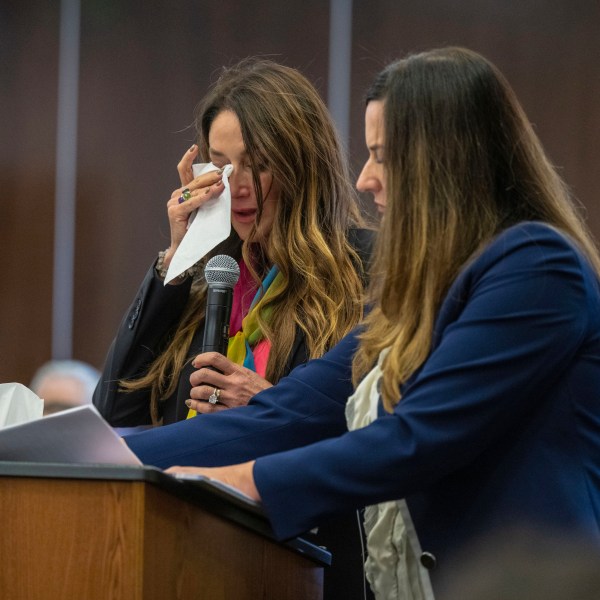 Jeanne Pepper, left, mother of Blaze Bernstein, wipes away tears as she gives a victim impact statement in court in Santa Ana, Calif., Friday, Nov. 15, 2024, prior to sentencing of Samuel Woodward, who was convicted of a hate crime murder for the killing of former classmate Blaze Bernstein. Senior Deputy District Attorney Jennifer Walker stands at right. (Mark Rightmire/The Orange County Register via AP, Pool)