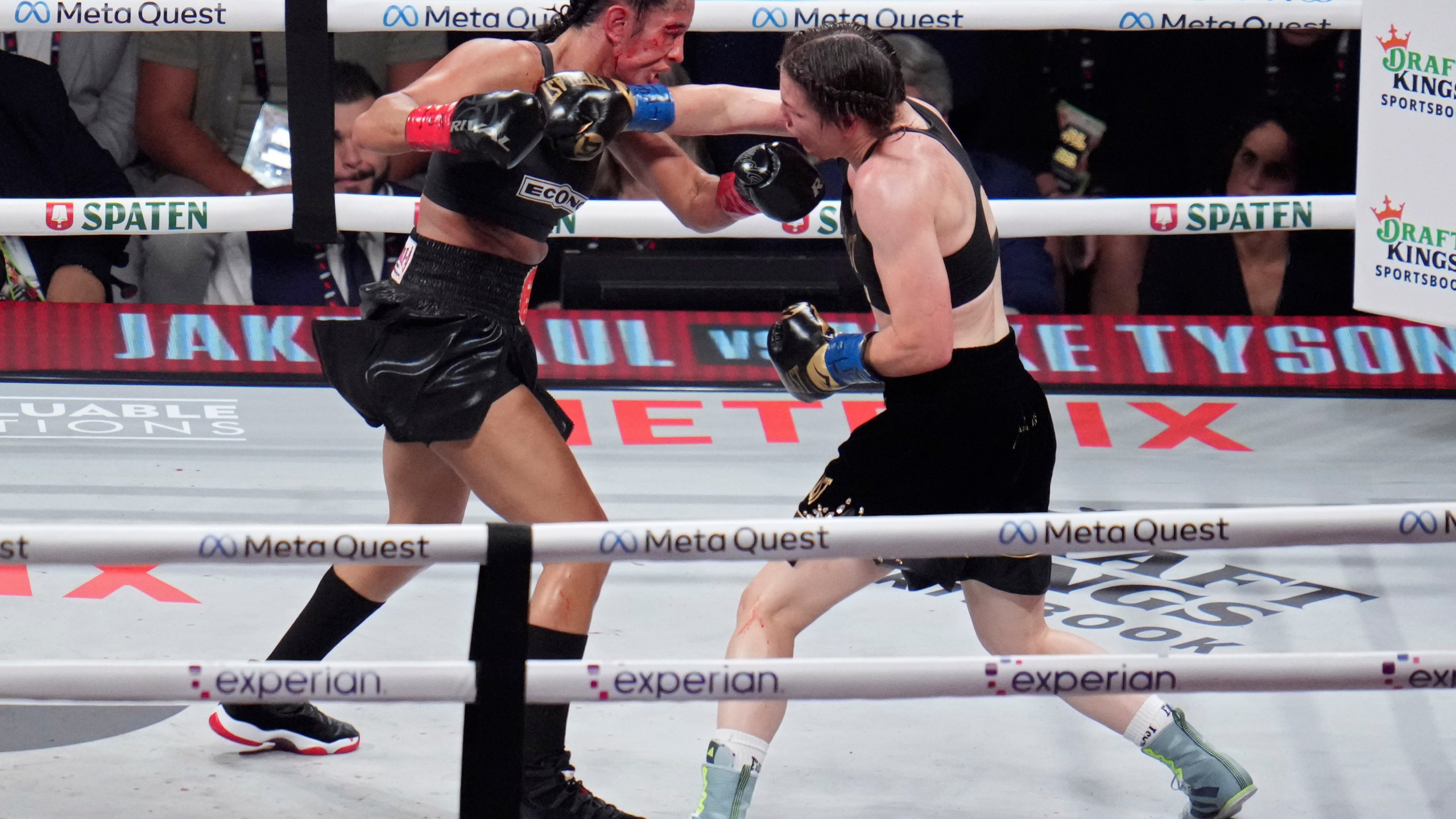 Katie Taylor, right, lands a right to Amanda Serrano during their undisputed super lightweight title bout, Friday, Nov. 15, 2024, in Arlington, Texas. (AP Photo/Julio Cortez)