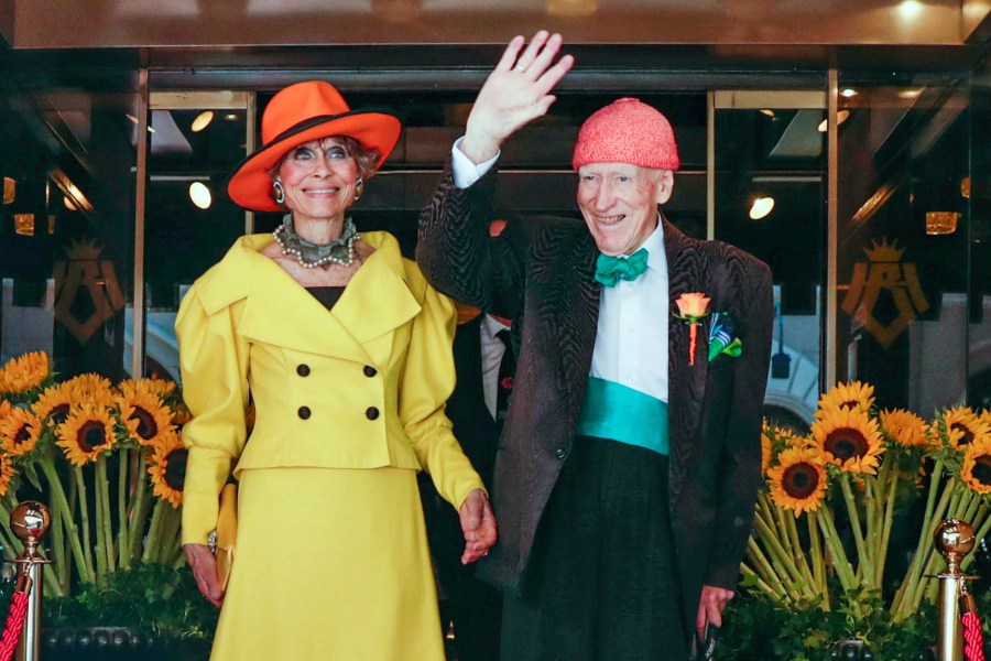 FILE - 95 year old businessman and billionaire Olav Thon, right poses for a photo with Sissel Berdal Haga, after their wedding at Hotel Bristol in Oslo, Friday, June 21, 2019. (Berit Roald/NTB Scanpix via AP, File)