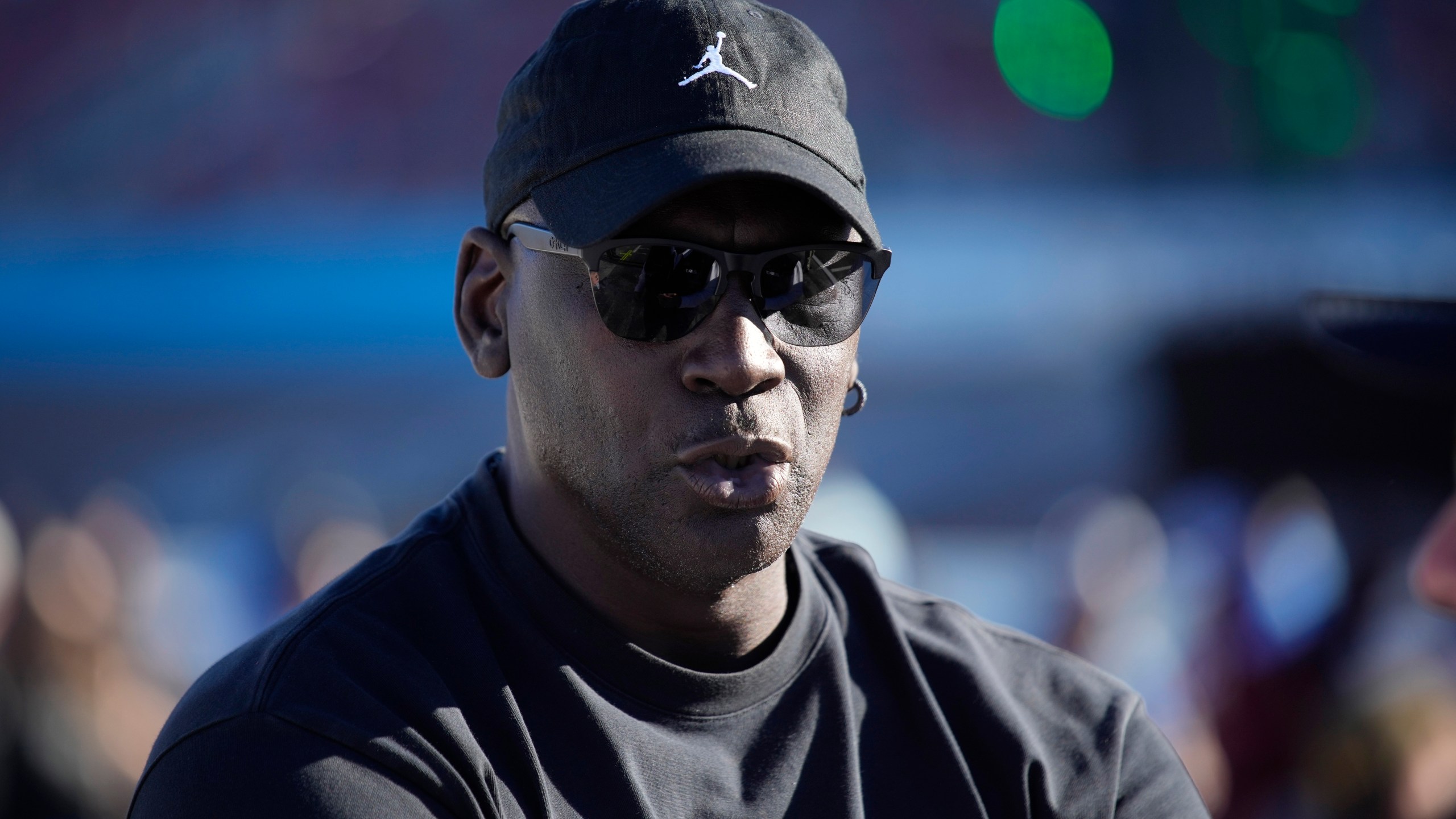 Michael Jordan, co-owner of 23XI Racing, watches during qualifying for a NASCAR Cup Series Championship auto race, Saturday, Nov. 9, 2024, in Avondale, Ariz. (AP Photo/John Locher)