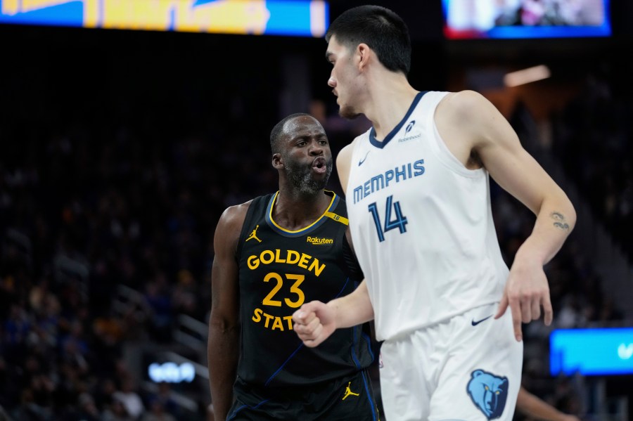 Golden State Warriors forward Draymond Green, left, reacts after making a 3-point basket during the second half of an Emirates NBA Cup basketball game against the Memphis Grizzlies, Friday, Nov. 15, 2024, in San Francisco. (AP Photo/Godofredo A. Vásquez)