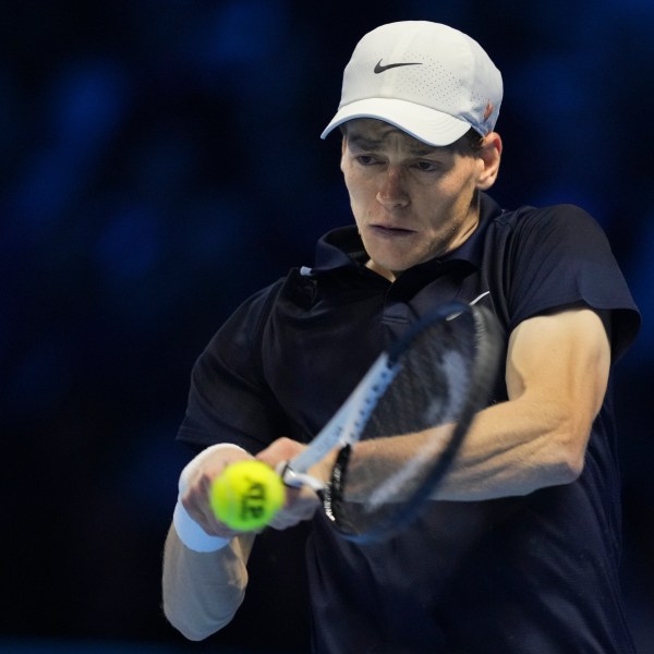 Italy's Jannik Sinner returns to Norway's Casper Ruud during their semifinal tennis match of the ATP World Tour Finals at the Inalpi Arena in Turin, Italy, Saturday, Nov. 16, 2024. (AP Photo/Antonio Calanni)