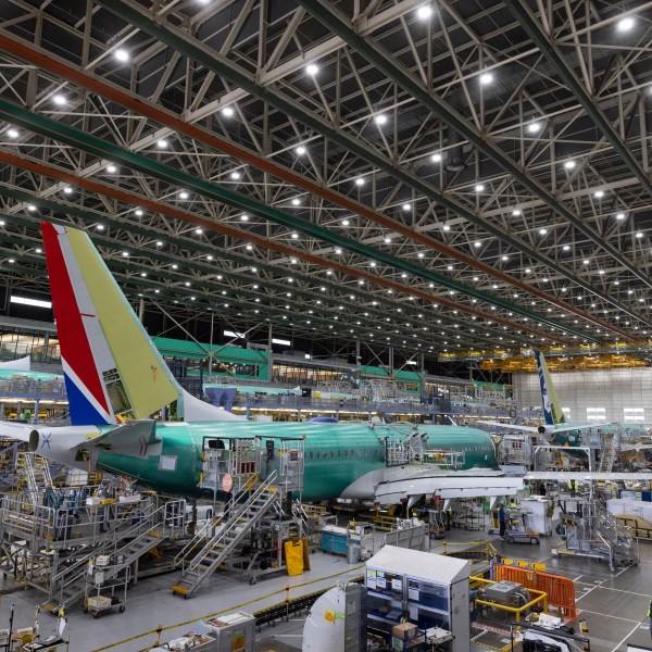 FILE - Boeing employees work on the 737 MAX on the final assembly line at Boeing's Renton plant, June 15, 2022, in Renton, Wash. (Ellen M. Banner/The Seattle Times via AP, Pool, File)