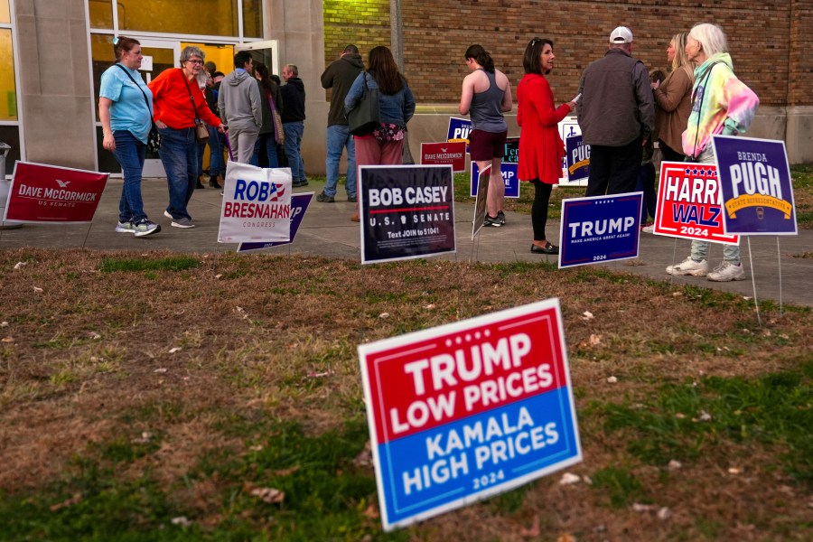 FILE - Voters wait in line to cast their ballots at the Kingston Armory in Wilkes-Barre, Pa, Nov. 5, 2024. (AP Photo/Matt Rourke, File)