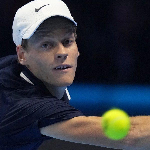 Italy's Jannik Sinner returns to Taylor Fritz of the United States during the final match of the ATP World Tour Finals at the Inalpi Arena, in Turin, Italy, Sunday, Nov. 17, 2024. (AP Photo/Antonio Calanni)