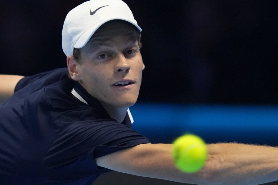 Italy's Jannik Sinner returns to Taylor Fritz of the United States during the final match of the ATP World Tour Finals at the Inalpi Arena, in Turin, Italy, Sunday, Nov. 17, 2024. (AP Photo/Antonio Calanni)