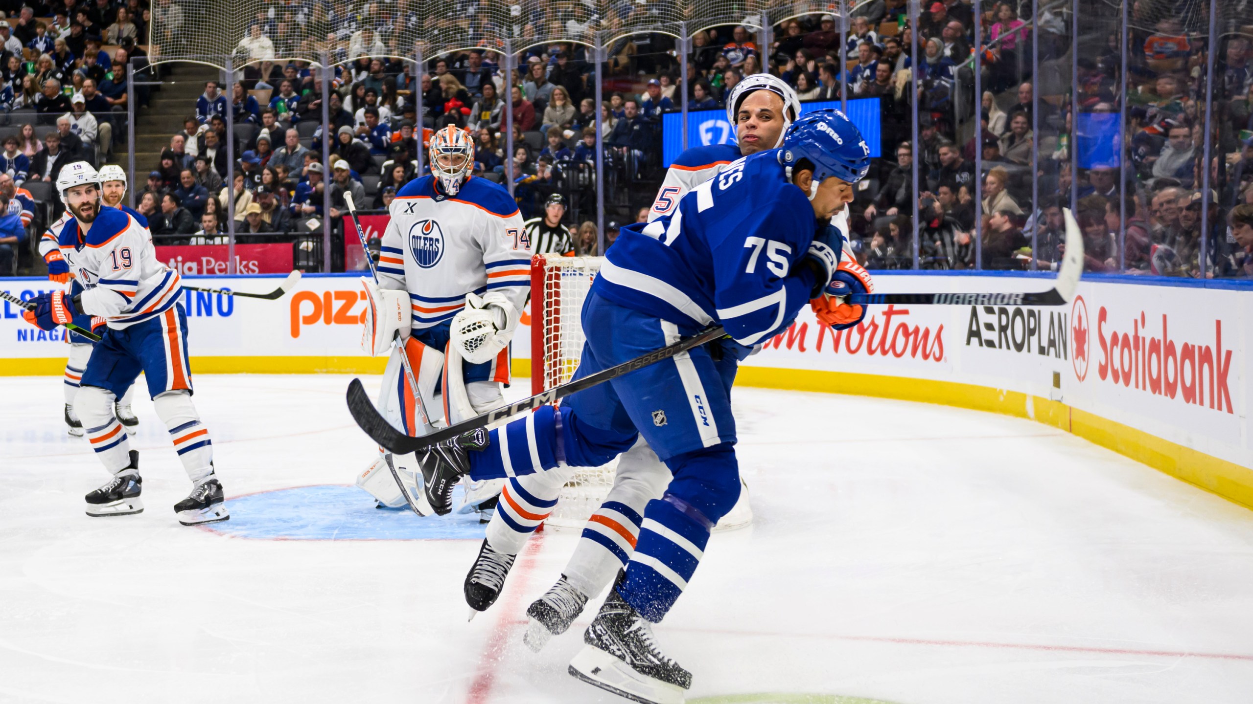 Toronto Maple Leafs right wing Ryan Reaves (75) collides with Edmonton Oilers defenseman Darnell Nurse (25) during the second period of an NHL hockey game, Saturday, Nov. 16, 2024 in Toronto. (Christopher Katsarov/The Canadian Press via AP)