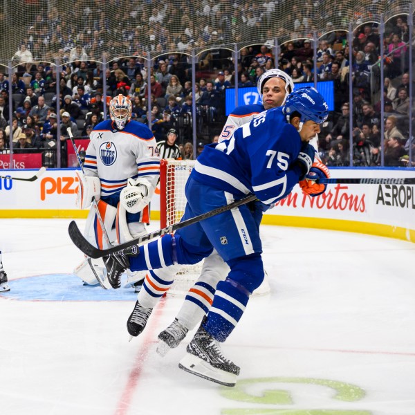 Toronto Maple Leafs right wing Ryan Reaves (75) collides with Edmonton Oilers defenseman Darnell Nurse (25) during the second period of an NHL hockey game, Saturday, Nov. 16, 2024 in Toronto. (Christopher Katsarov/The Canadian Press via AP)