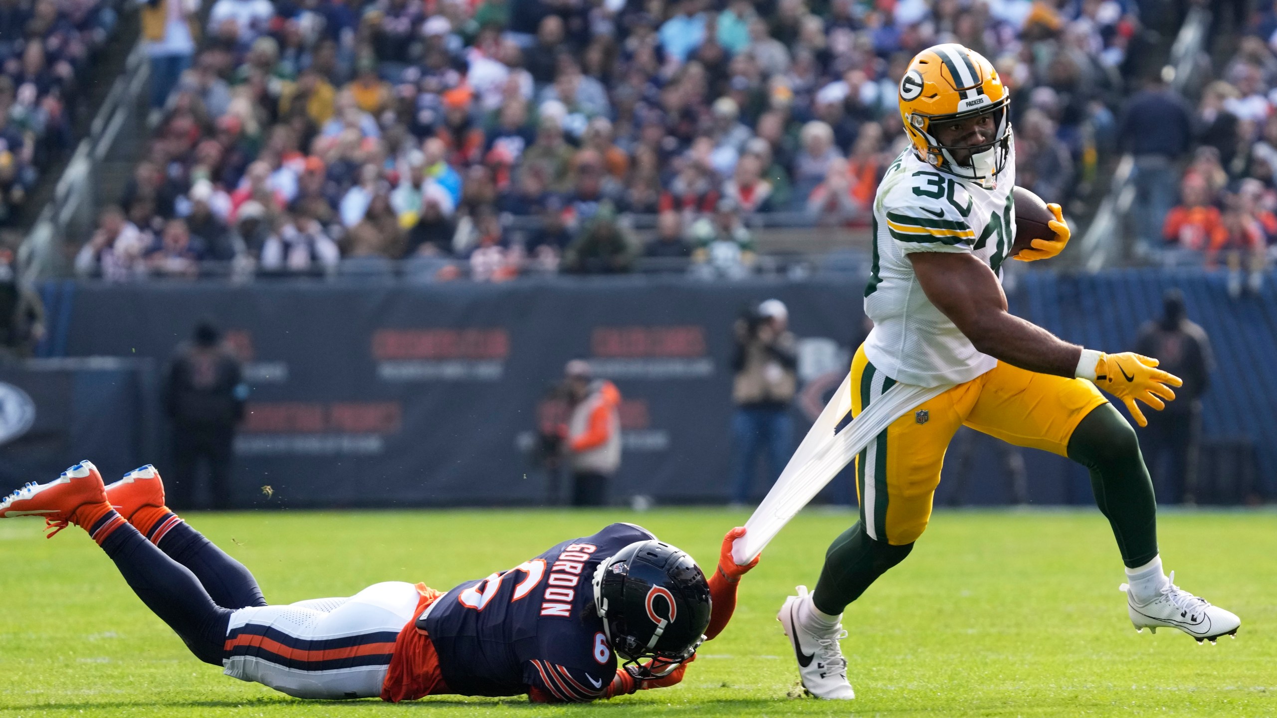 Chicago Bears' Kyler Gordon tries to stop Green Bay Packers' Chris Brooks during the first half of an NFL football game Sunday, Nov. 17, 2024, in Chicago. (AP Photo/Nam Y. Huh)