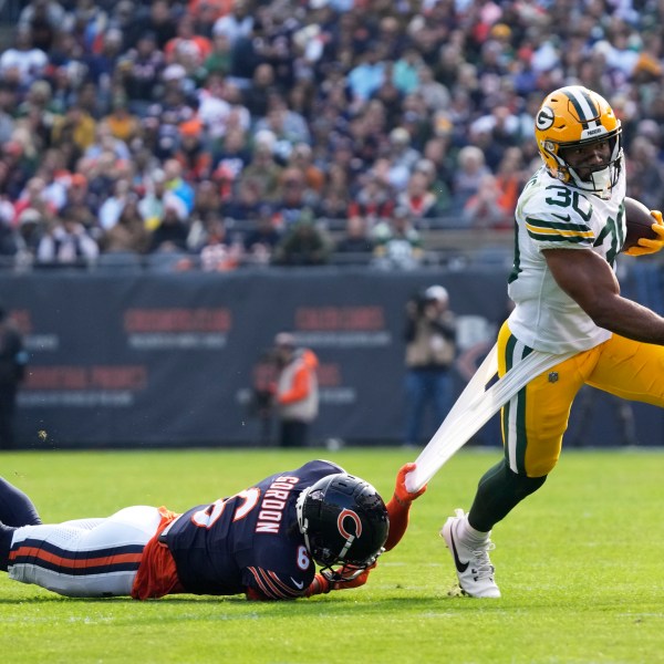 Chicago Bears' Kyler Gordon tries to stop Green Bay Packers' Chris Brooks during the first half of an NFL football game Sunday, Nov. 17, 2024, in Chicago. (AP Photo/Nam Y. Huh)