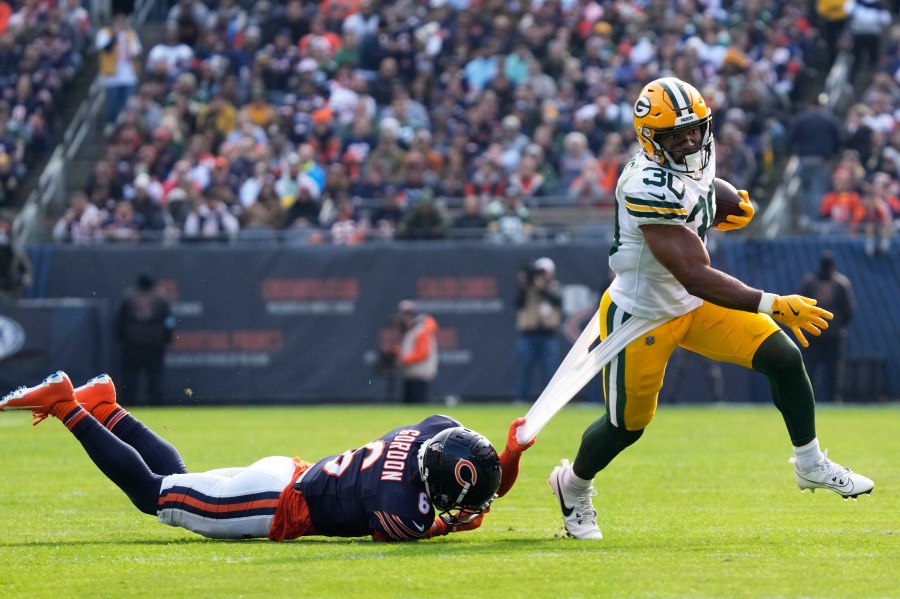 Chicago Bears' Kyler Gordon tries to stop Green Bay Packers' Chris Brooks during the first half of an NFL football game Sunday, Nov. 17, 2024, in Chicago. (AP Photo/Nam Y. Huh)