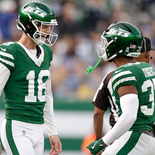 New York Jets place kicker Anders Carlson (18) celebrates with teammates after kicking a 58-yard field goal against the Indianapolis Colts during the third quarter of an NFL football game, Sunday, Nov. 17, 2024, in East Rutherford, N.J. (AP Photo/Adam Hunger)