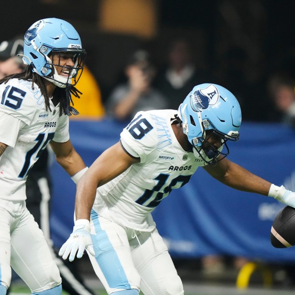 Toronto Argonauts' Dejon Brissett (18) celebrates his interception against the Winnipeg Blue Bombers during the second half of a CFL football game at the 111th Grey Cup in Vancouver, British Columbia, Sunday, Nov. 17, 2024. (Frank Gunn/The Canadian Press via AP)