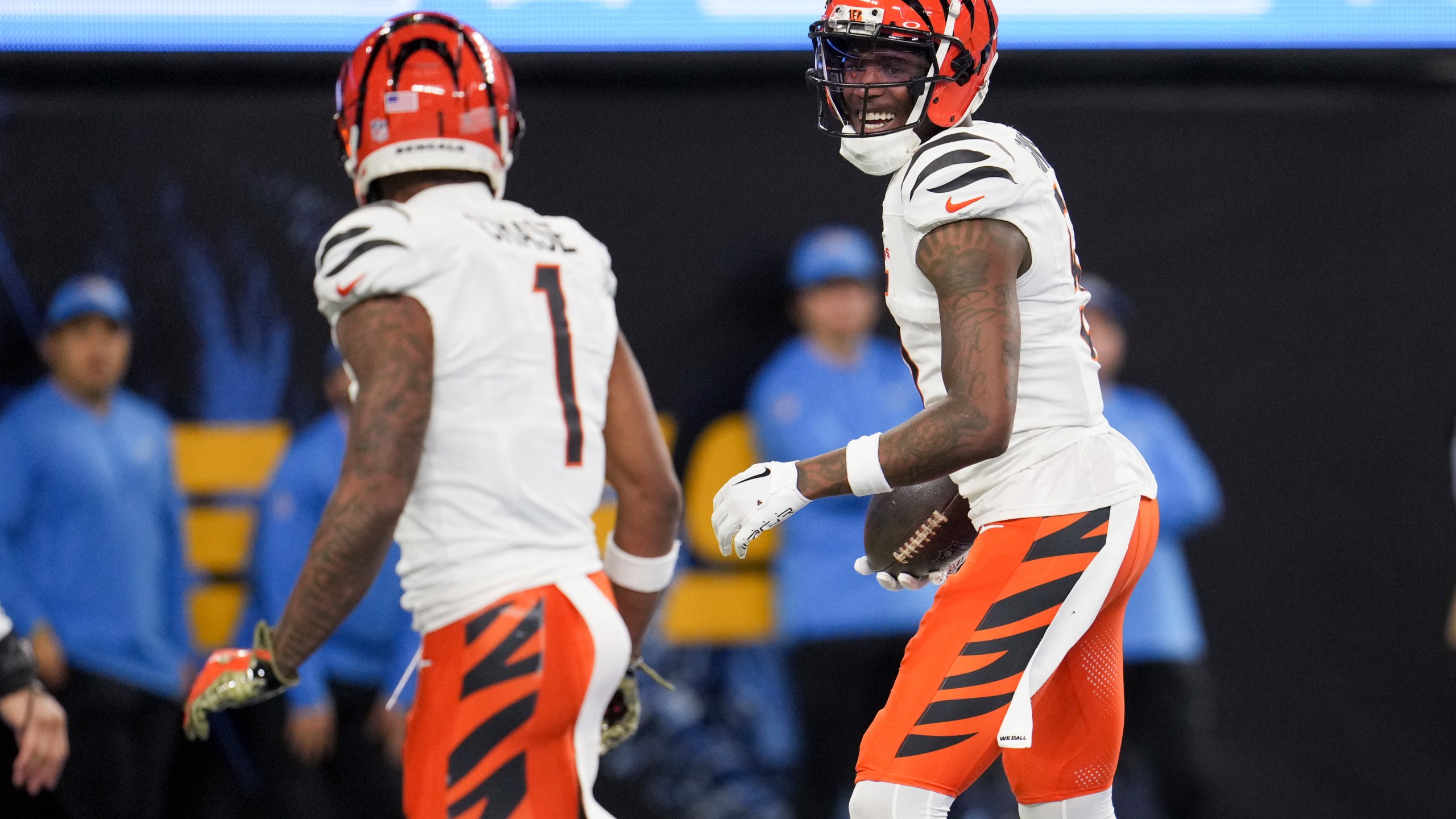 Cincinnati Bengals wide receiver Tee Higgins, right, celebrates his touchdown catch with wide receiver Ja'Marr Chase (1) during the second half of an NFL football game against the Los Angeles Chargers, Sunday, Nov. 17, 2024, in Inglewood, Calif. (AP Photo/Eric Thayer)