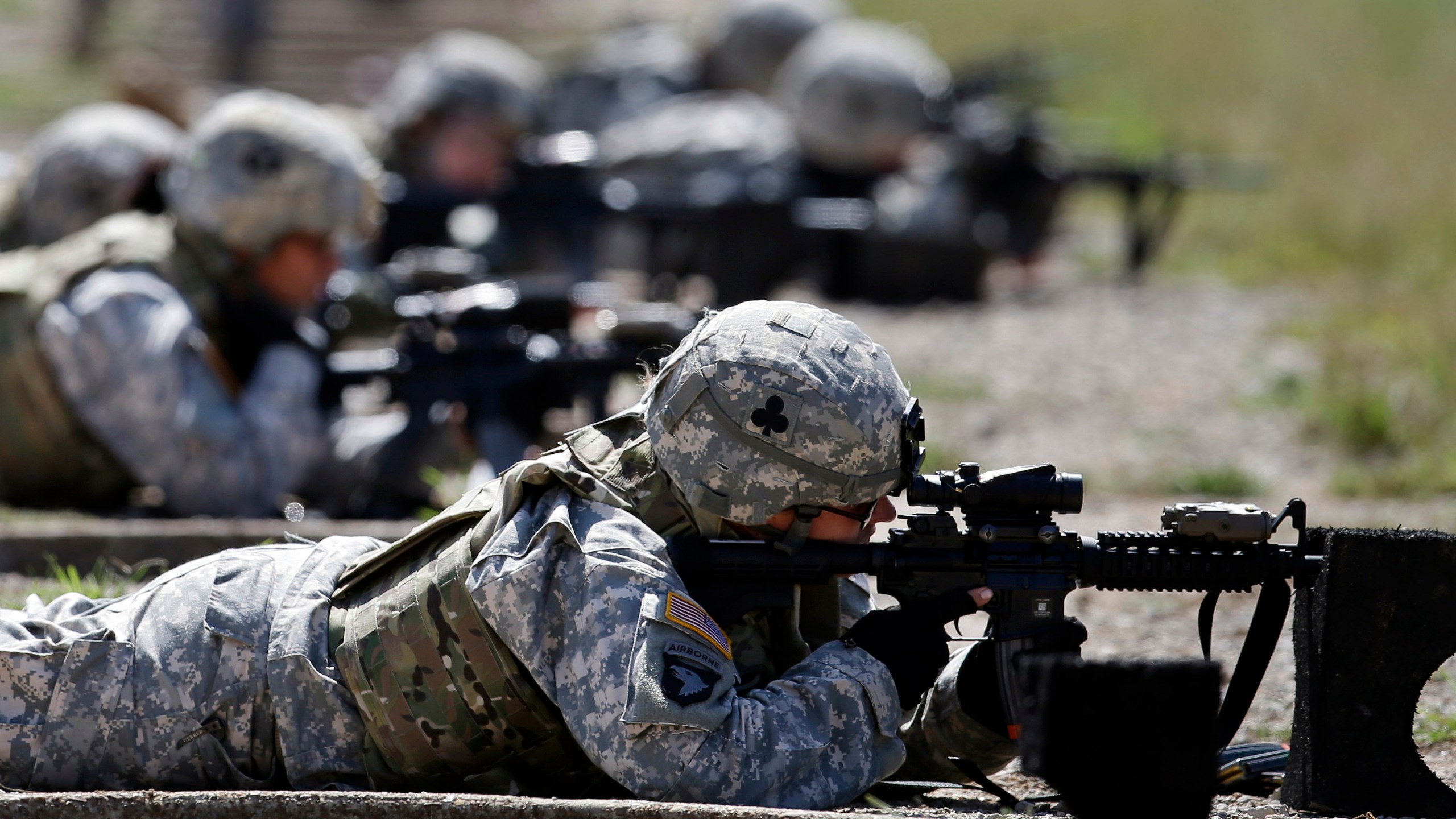 FILE - Female soldiers from 1st Brigade Combat Team, 101st Airborne Division train on a firing range while testing new body armor in Fort Campbell, Ky., Sept. 18, 2012. (AP Photo/Mark Humphrey, File)