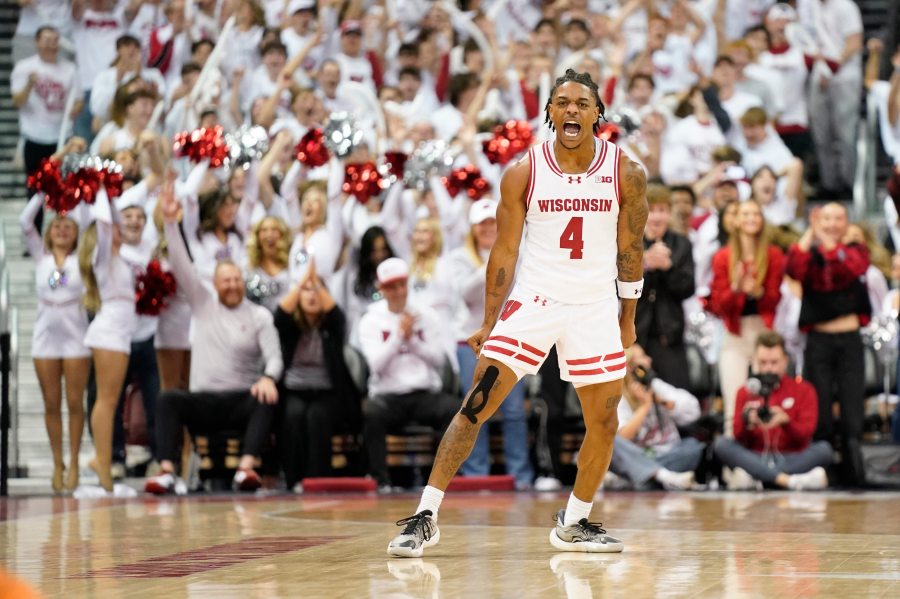 Wisconsin guard Kamari McGee (4) celebrates scoring a basket against Arizona during the second half of an NCAA college basketball game Friday, Nov. 15, 2024, at the Kohl Center in Madison, Wis. (AP Photo/Kayla Wolf)