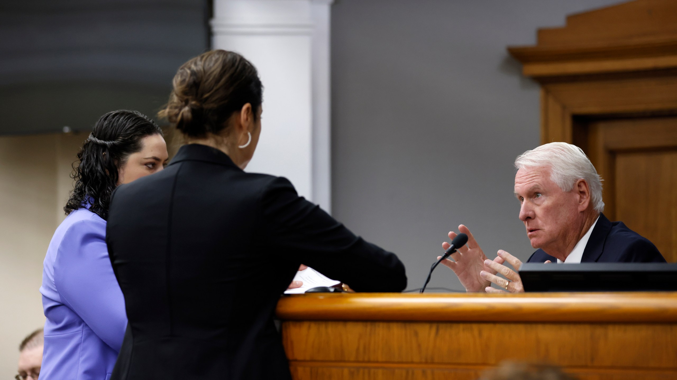 Superior Court Judge H. Patrick Haggard, right, confers with prosecutors and attorneys for Jose Ibarra during the second day of the trial of Jose Ibarra at Athens-Clarke County Superior Court on Monday, Nov. 18, 2024, in Athens, Ga. (Miguel Martinez/Atlanta Journal-Constitution via AP, Pool)