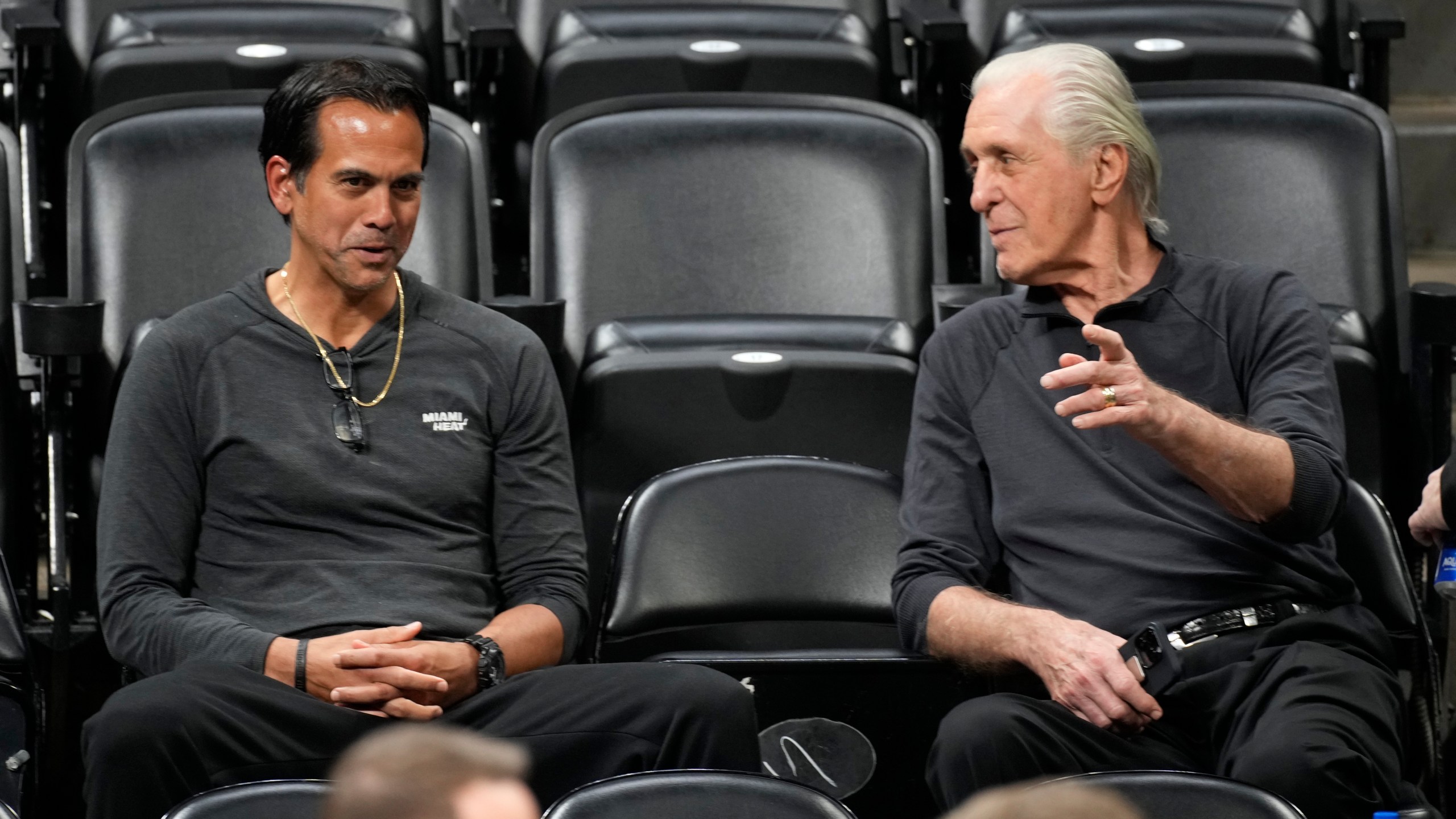 Miami Heat head coach Erik Spoelstra, left, chats with team president Pat Riley as they watch players practice for Game 2 of the NBA Finals, June 3, 2023, in Denver. (AP Photo/David Zalubowski, file)