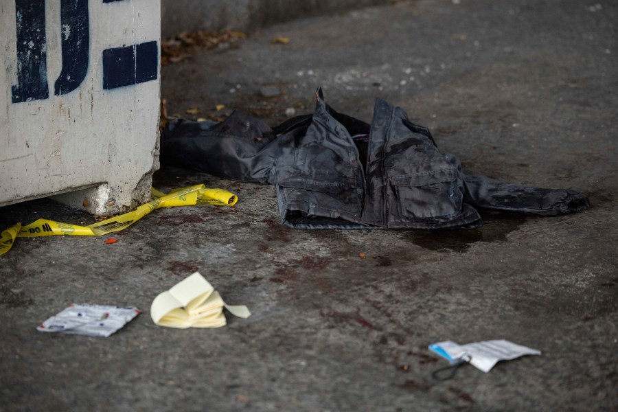 A jacket covered in blood lays on the ground at the site of a stabbing spree near the United Nations Headquarters in New York, Monday, Nov. 18, 2024. (AP Photo/Yuki Iwamura)