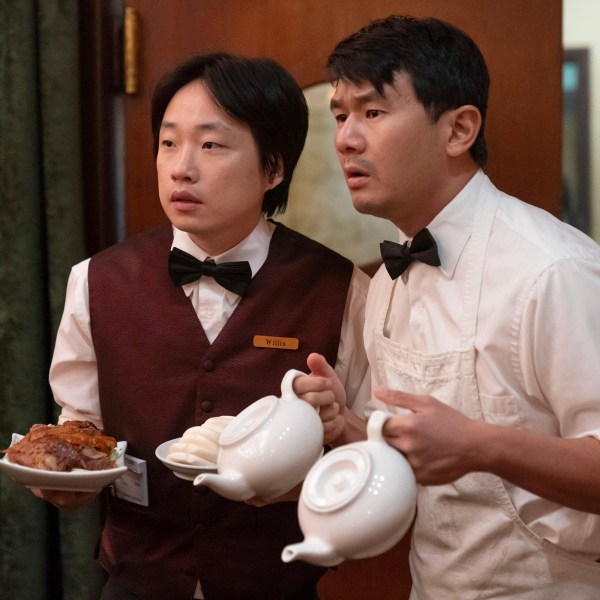 This image released by Hulu shows Jimmy O. Yang, left, and Ronny Chieng in a scene from the series "Interior Chinatown." (Mike Taing/Hulu via AP)