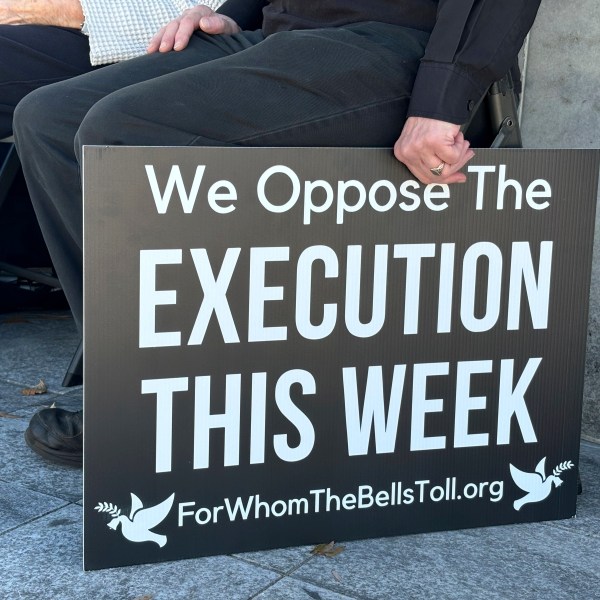 A demonstrator holds a sign during a protest outside the Capitol in Montgomery, Ala., on Monday, Nov. 18, 2024, against a scheduled execution in Alabama using nitrogen gas. (Kim Chandler/Associated Press)