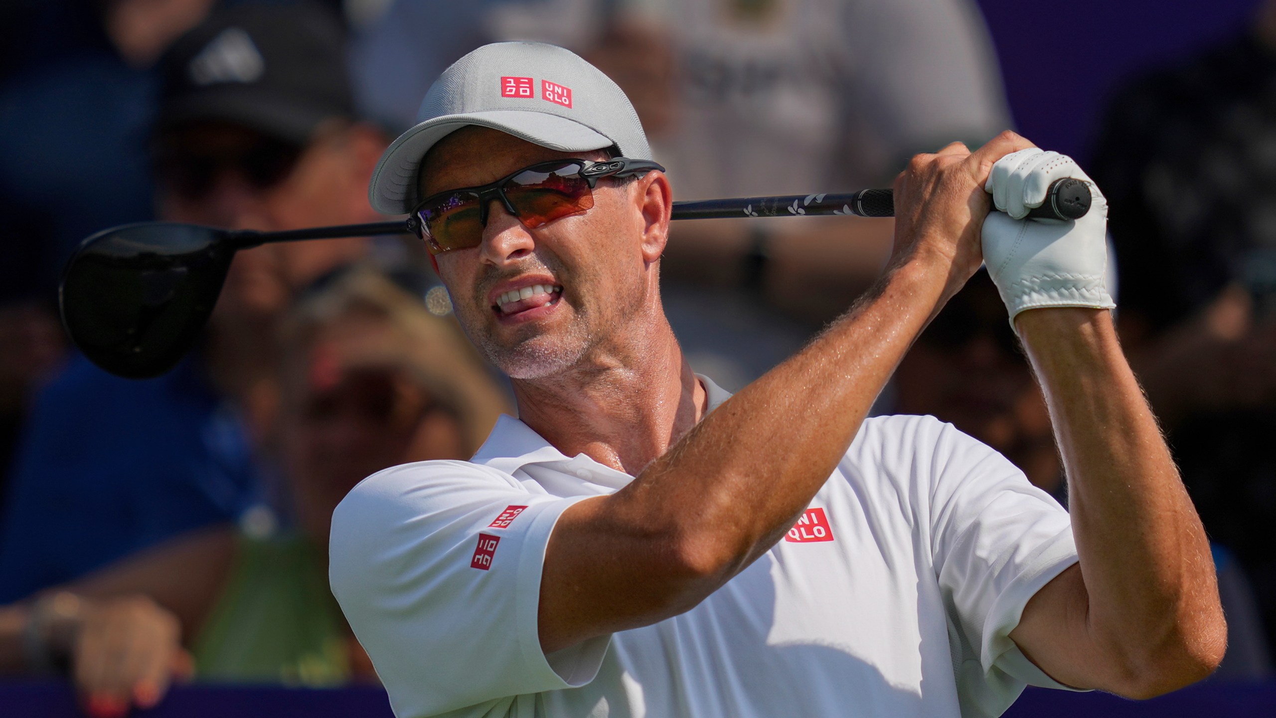 Adam Scott of Australia reacts after hitting off the first tee during the first round of World Tour Golf Championship in Dubai, United Arab Emirates, Thursday, Nov. 14, 2024. (AP Photo/Altaf Qadri)