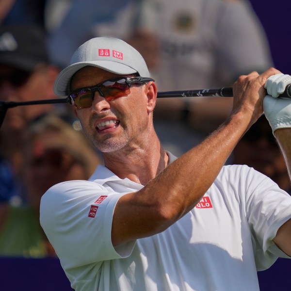 Adam Scott of Australia reacts after hitting off the first tee during the first round of World Tour Golf Championship in Dubai, United Arab Emirates, Thursday, Nov. 14, 2024. (AP Photo/Altaf Qadri)