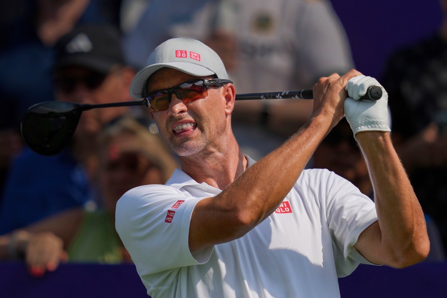 Adam Scott of Australia reacts after hitting off the first tee during the first round of World Tour Golf Championship in Dubai, United Arab Emirates, Thursday, Nov. 14, 2024. (AP Photo/Altaf Qadri)