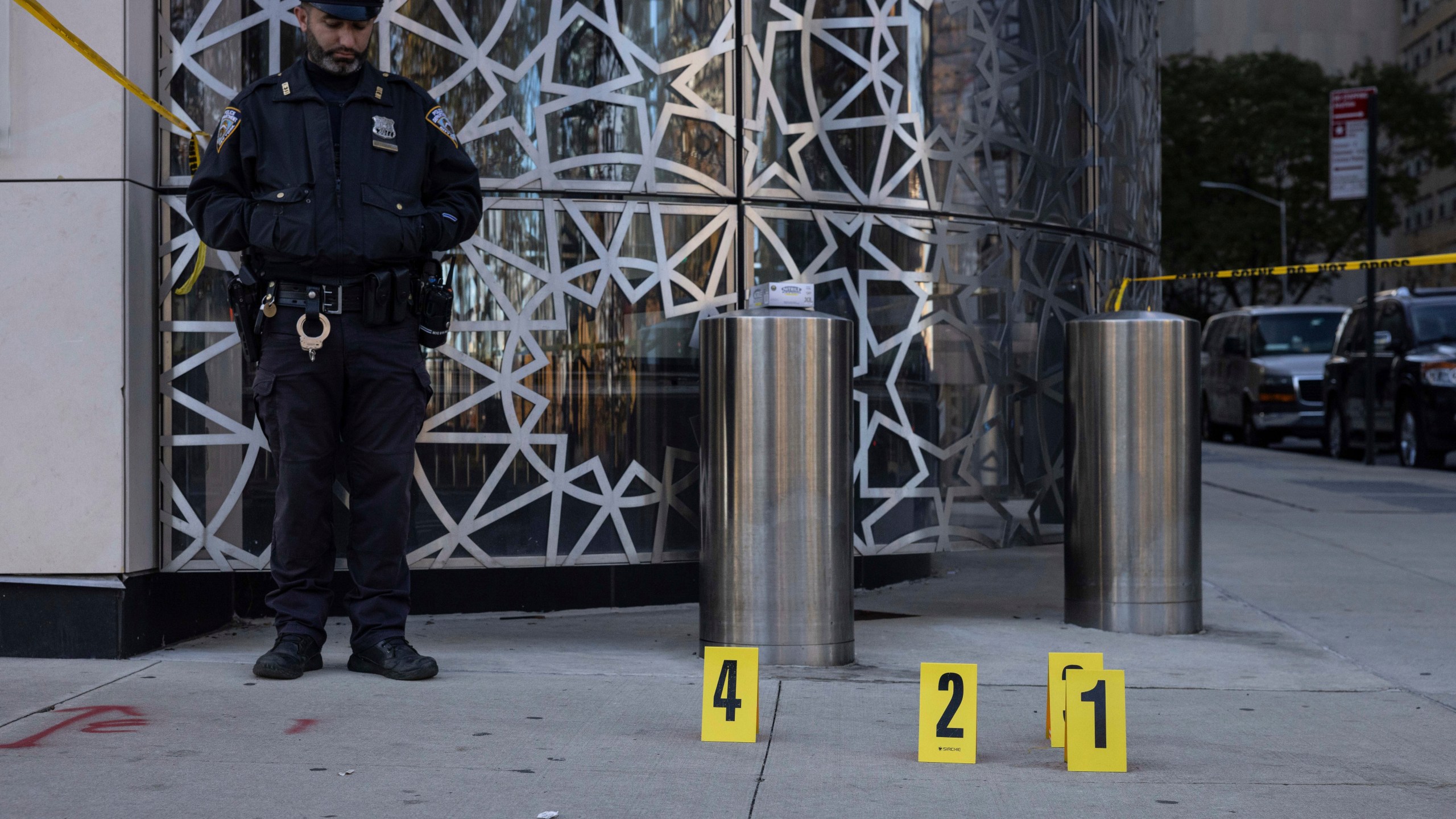 NYPD officers stand at the site where the suspect of a stabbing spree was captured outside Turkish House, New York, Monday, Nov. 18, 2024. (AP Photo/Yuki Iwamura)