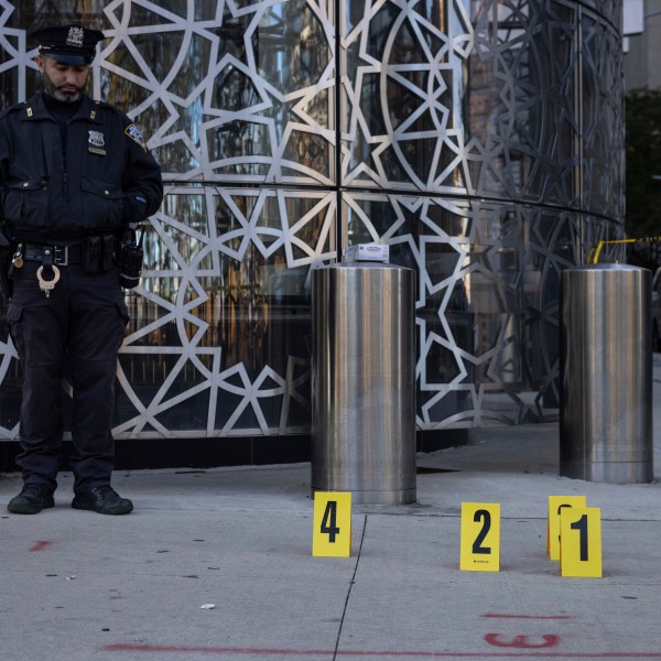 NYPD officers stand at the site where the suspect of a stabbing spree was captured outside Turkish House, New York, Monday, Nov. 18, 2024. (AP Photo/Yuki Iwamura)