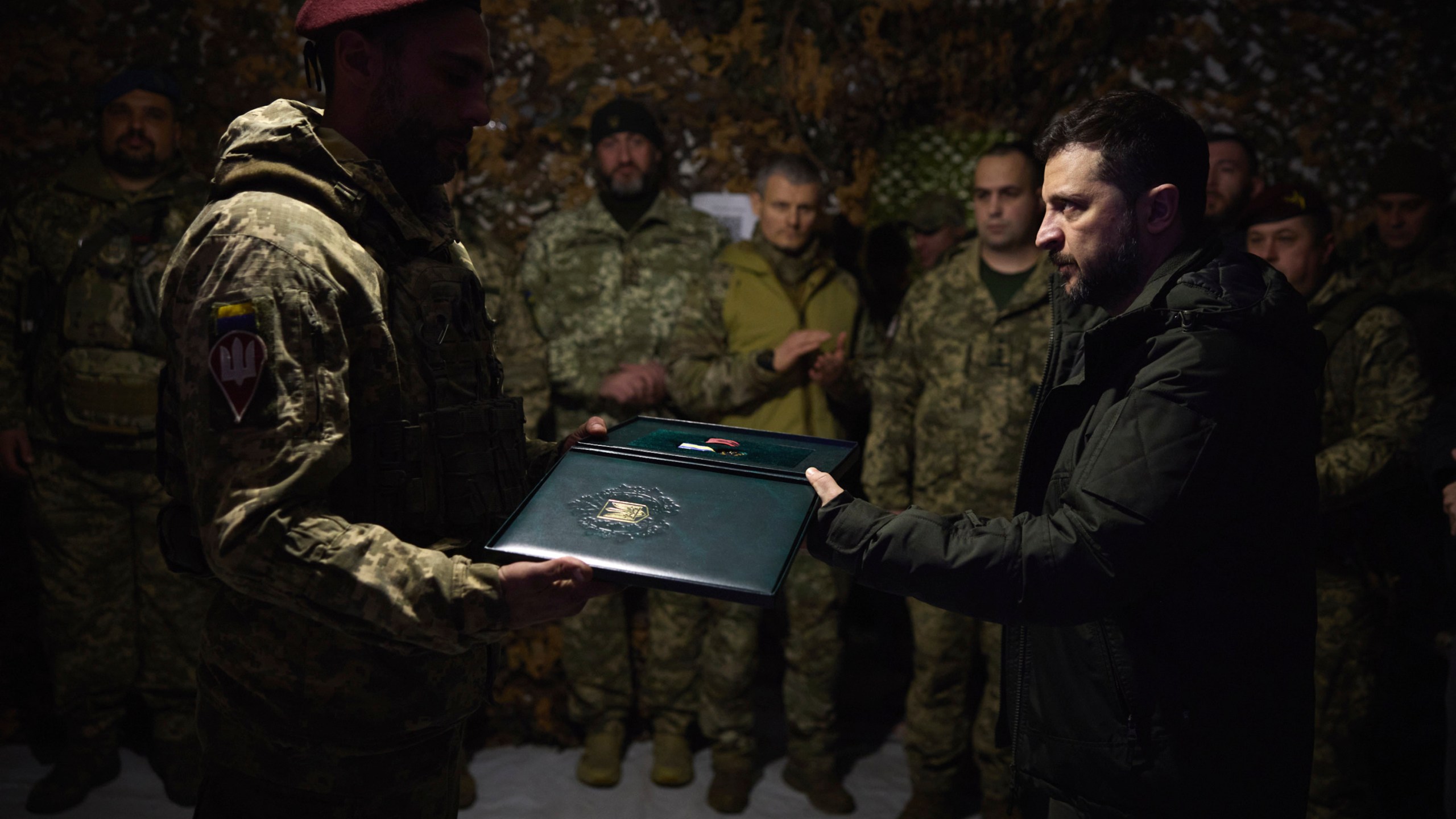 In this photo provided by the Ukrainian Presidential Press Office, Ukrainian President Volodymyr Zelenskyy awards servicemen in the frontline city of Pokrovsk, the site of heaviest battles with the Russian troops in the Donetsk region, Ukraine, Monday, Nov. 18, 2024. (Ukrainian Presidential Press Office via AP)